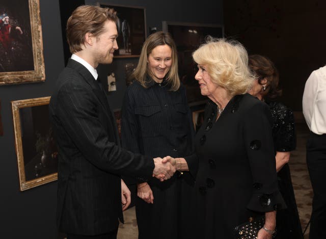 The Queen with actors Joe Alwyn and Alice Felton