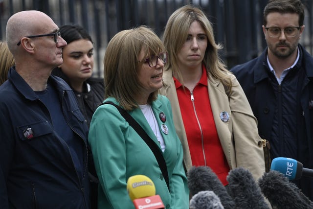 Lyra McKee’s sister Nichola Corner (centre) speaking to the media outside Belfast Crown Court
