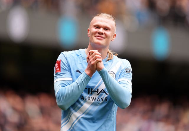 Manchester City’s Erling Haaland clasps his hands as he celebrates a goal