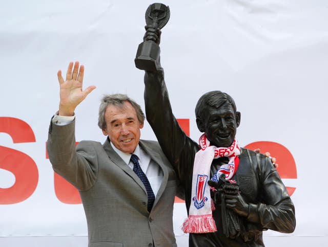 Gordon Banks stands next to his statue at the Britannia Stadium
