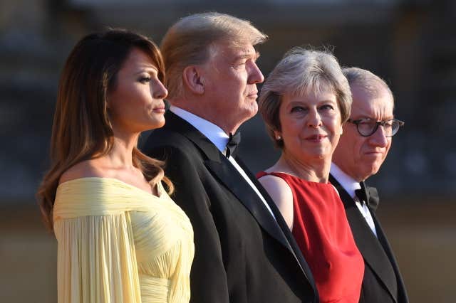 Donald Trump and his wife Melania are welcomed by Theresa May and her husband Philip at Blenheim Palace