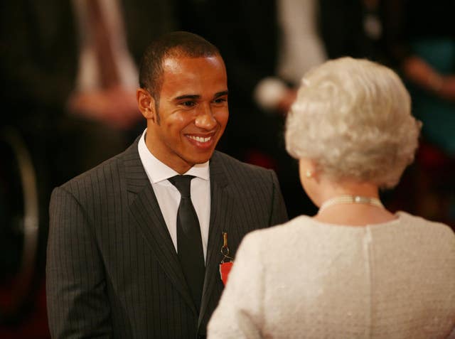 Hamilton was awarded an MBE by the Queen after he won his first title 