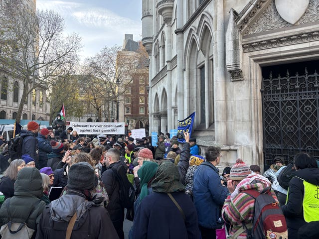 Palestine Action supporters outside the Royal Courts of Justice, where the judicial review is taking place