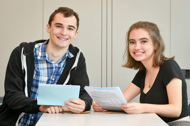 Henry Popkin and Lauren Carey celebrate their A-level results at St Mary Redcliffe and Temple School in Bristol (Ben Birchall/PA)