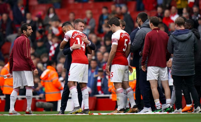 Arsenal's Aaron Ramsey says goodbye to his team-mates on the pitch