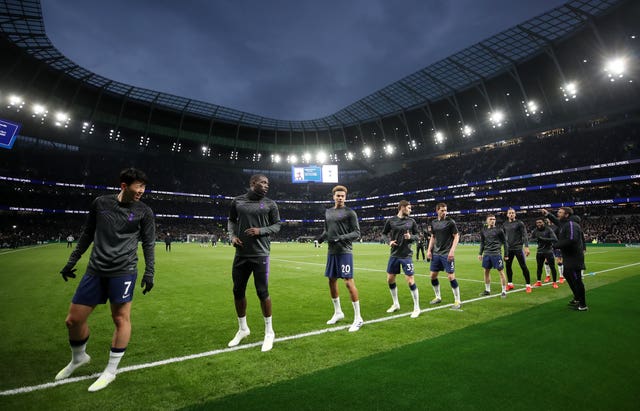 Spurs' players warm up at the new stadium