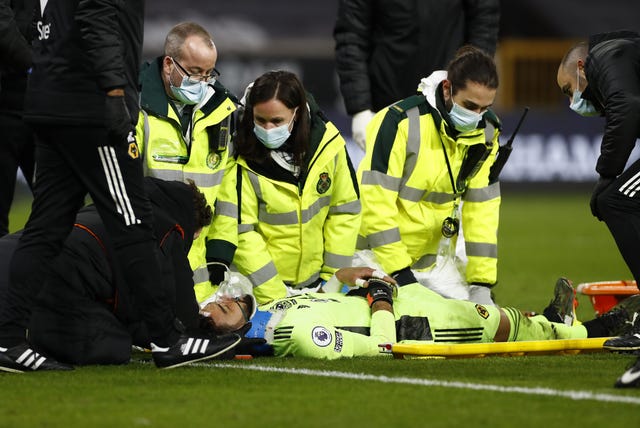 Rui Patricio is treated on the pitch before being taken off on a stretcher 