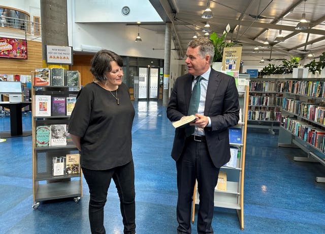 Senior librarian Clodagh Kingston speaks to Minister for Public Expenditure Paschal Donohoe at Cabra Library in Dublin