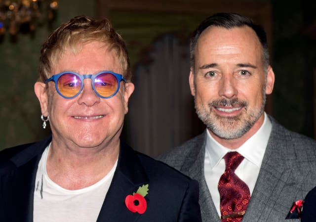 Sir Elton John and David Furnish at Winfield House in London (Hannah McKay/PA)