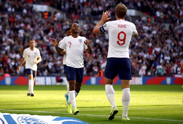 Raheem Sterling is congratulated on his goal by Harry Kane