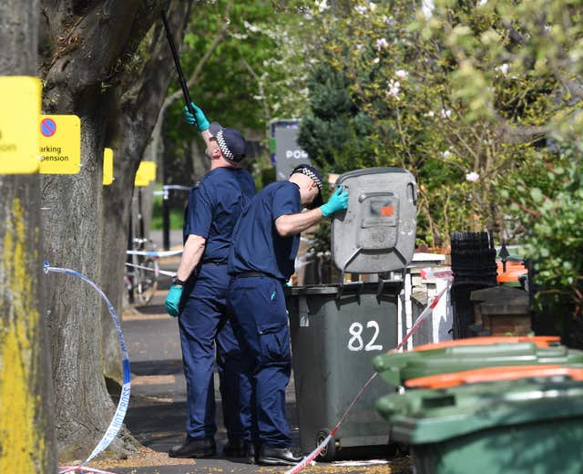 Officers search bins in Chestnut Avenue in Forest Gate after Sami Sidhom's death (Stefan Rousseau/PA)