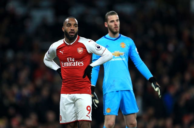 Arsenal’s Alexandre Lacazette (left) and Manchester United goalkeeper David De Gea