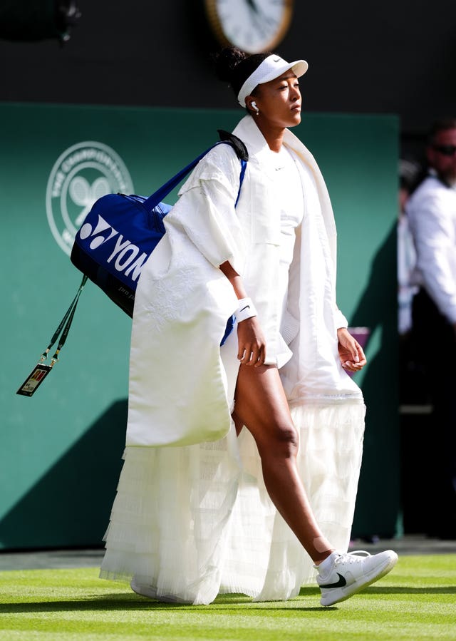 Naomi Osaka walks onto Centre Court