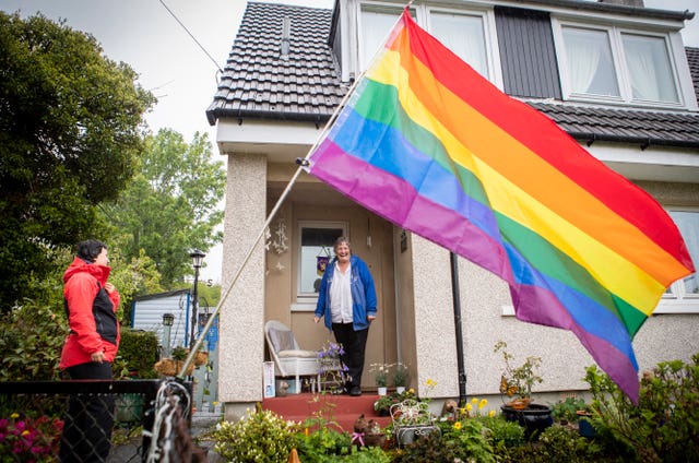Becs Barker (left) chats to her neighbour Jan Brown on her doorstep