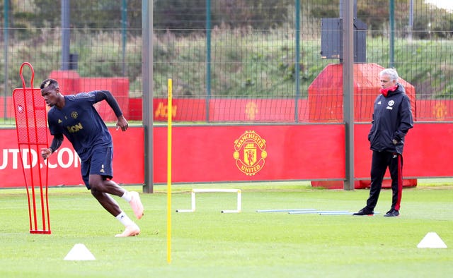 Pogba, left, initially struggled under Jose Mourinho (Martin Rickett/PA)