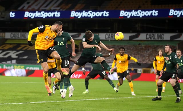 Romain Saiss (left) heads home the Wolves equaliser