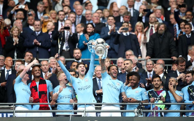 Manchester City’s players celebrate the FA Cup triumph 