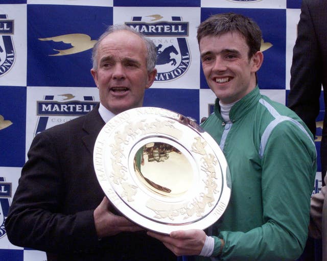 Ruby Walsh receives the winning trophy from his father Ted