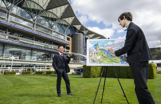 Dettori poses for a specially commissioned piece of art designed by artist, Clym Evernden