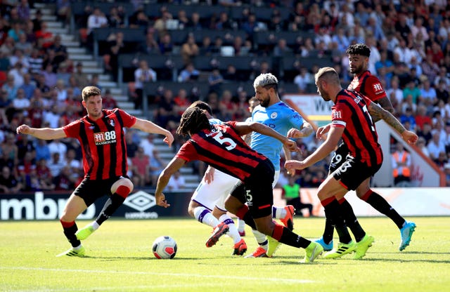 Sergio Aguero, centre, scores City’s third goal