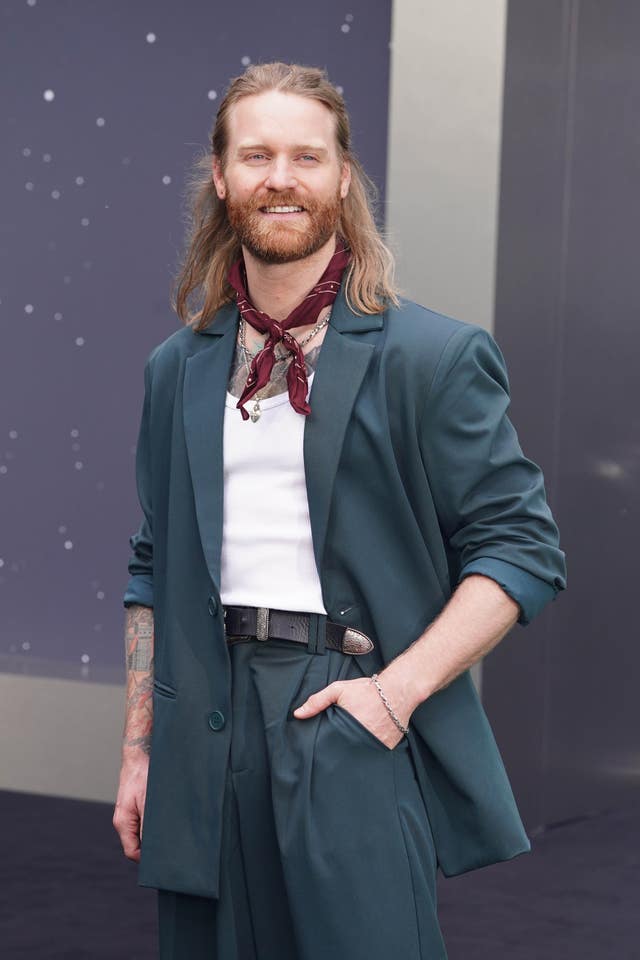 Sam Ryder poses for photographers at a Star Wars: The Mandalorian and Grogu UK fan event