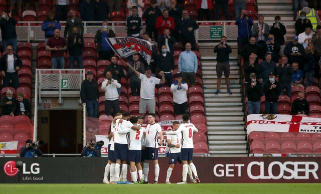 England players and fans celebrate Bukayo Saka's winner against Austria