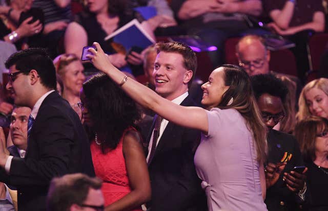Audience members take selfies before the concert began (Andrew Parsons/Sunday Times/PA)
