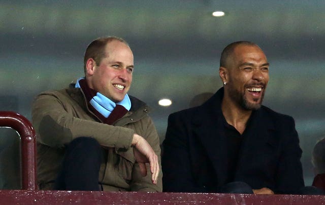 William watching Aston Villa with one of the club's former players John Carew. Paul Harding/PA Wire