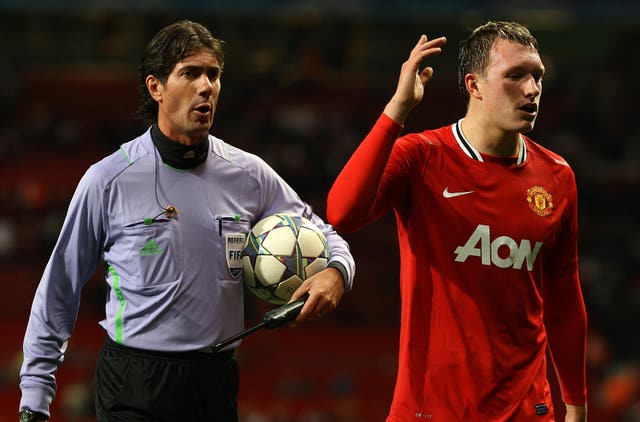 Phil Jones (right) scored a late goal, but it was not enough for United to progress