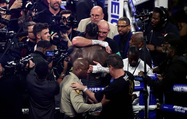 The fighters embraced after the bout