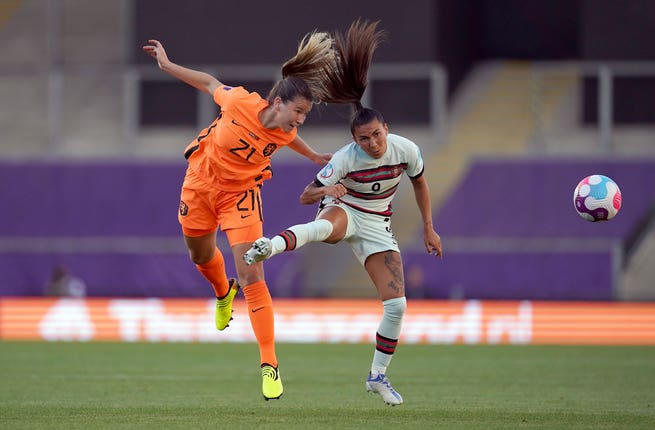 Holland's Damaris Egurrola, left and Portugal’s Ana Borges battle for the ball during their Group C match