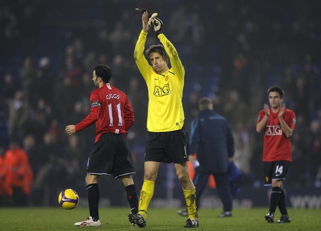 Manchester United’s goalkeeper Edwin Van der Sar celebrates after the final whistle