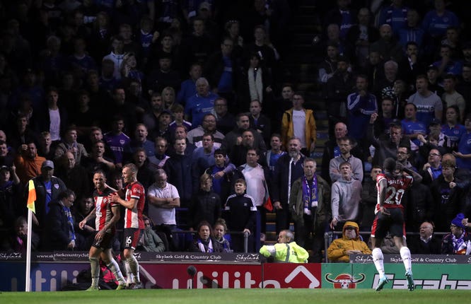 Danny Ings celebrates his second in front of the Portsmouth fans