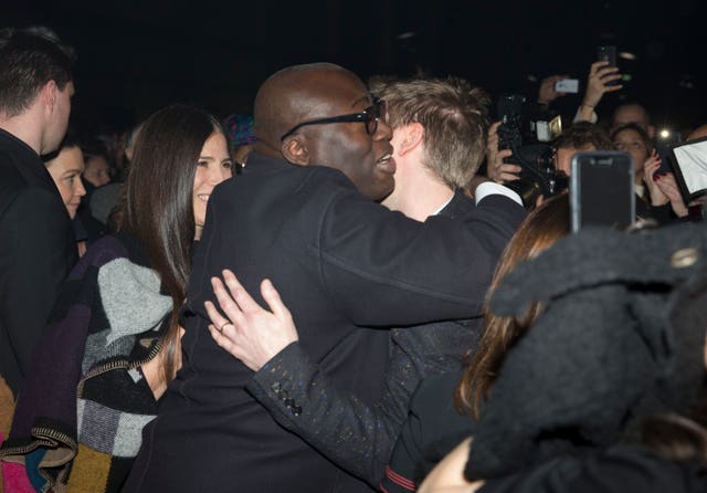 Burberry creative director and former CEO Christopher Bailey hugs Vogue editor Edward Enninful (Isabel Infantes/PA)