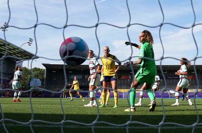 Sweden’s Filippa Angeldal, background second left, scores during her side's 5-0 win against Portugal, which sealed their place in the Euro 2022 quarter-finals