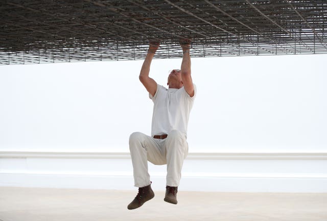 Antony Gormley poses with his installation Matrix III (2019)