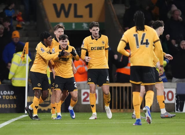 Rodrigo Gomes, third left, celebrates his opener with his Wolves team-mates
