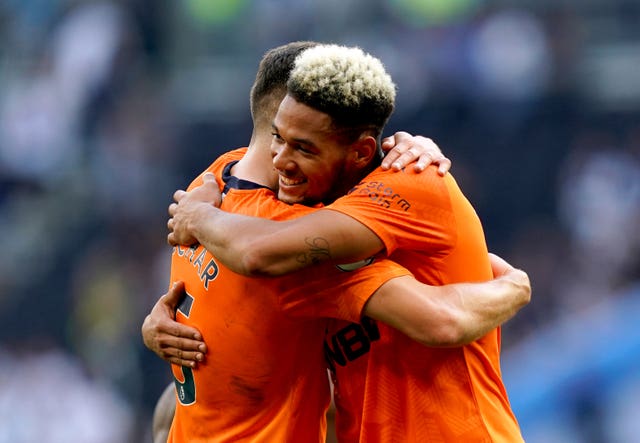 Newcastle's Joelinton celebrated with team-mate Fabian Schar after beating Tottenham