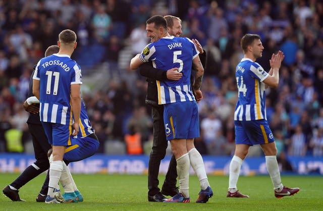 Graham Potter celebrates with Lewis Dunk