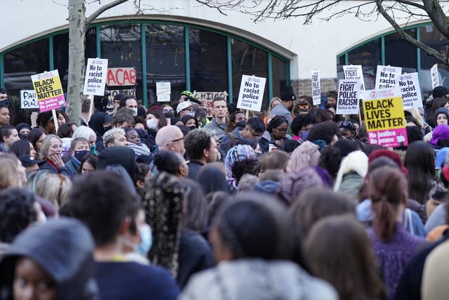 People demonstrate outside Stoke Newington police station