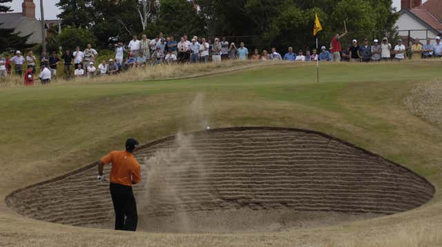Woods plays out from a bunker at the 135th Open Championship at Royal Liverpool Golf Club, Hoylake