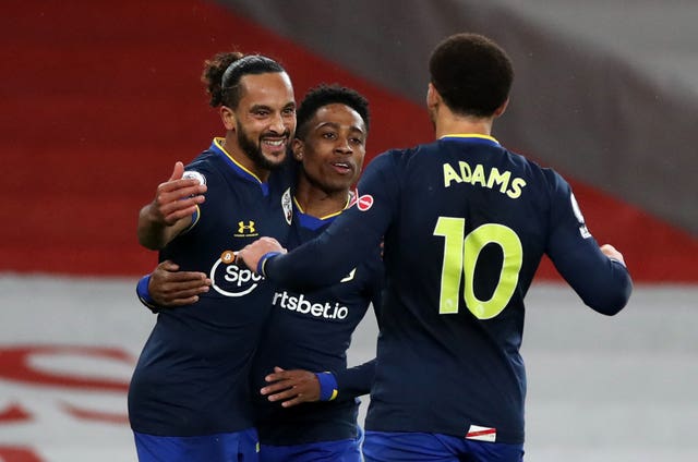 Theo Walcott (left) netted against his old team