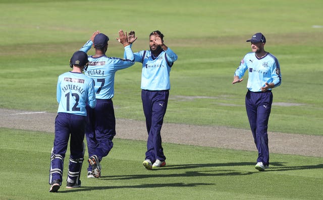 Rashid, centre, has taken 110 T20 wickets for Yorkshire (Martin Rickett/PA)