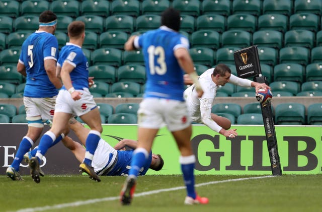 England's Jonny May takes to the air before touching down against Italy