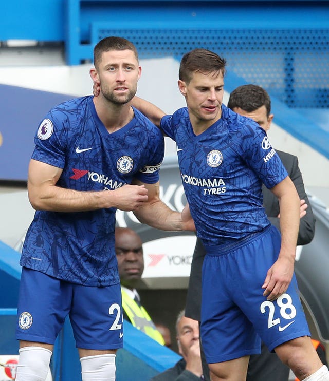 Gary Cahill, left, made just eight appearances for Chelsea last season
