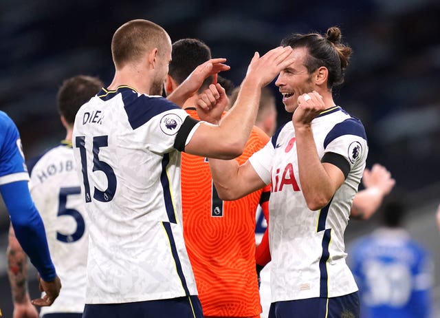 Erie Dier celebrates the win over Brighton with Gareth Bale