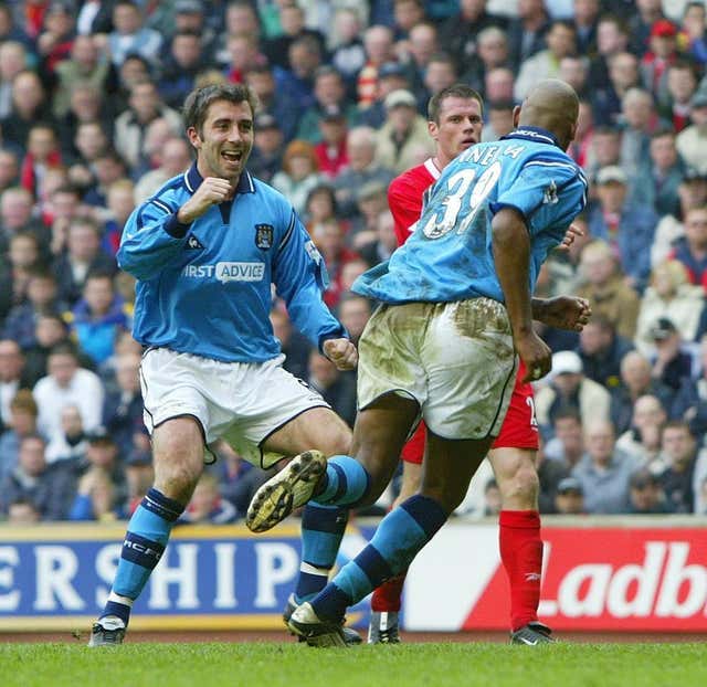 Nicolas Anelka, right, celebrates scoring a penalty at Anfield in City's last Premier League win at Anfield in May 2003