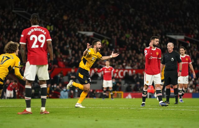 Wolverhampton Wanderers’ Joao Moutinho (centre) celebrates scoring at Manchester United