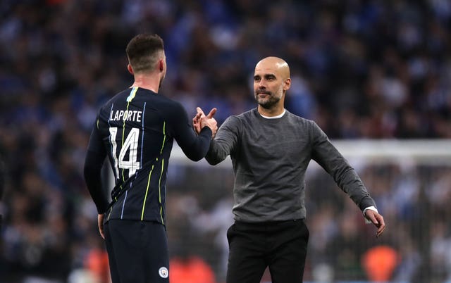 Laporte (left) was a key man for Pep Guardiola (right) last season