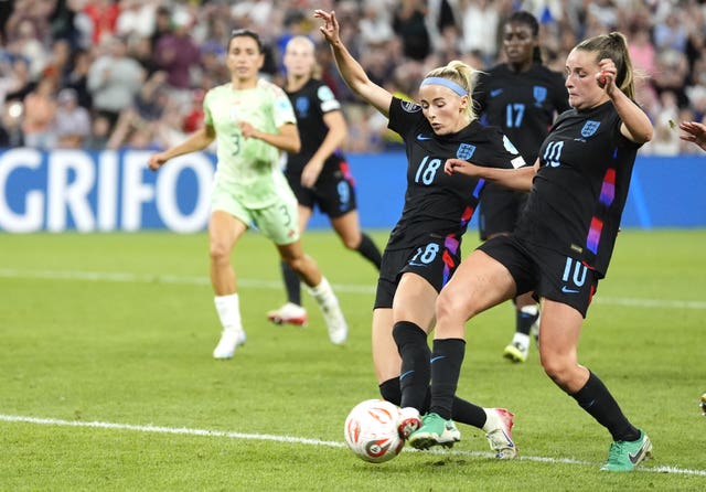 Chloe Kelly, centre, beats Ella Toone to the ball to score England's winner against Italy